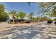 Charming exterior view of a building with palm trees and unique architectural details near a street at 315 Ridge Rd, Palm Harbor, FL 34683