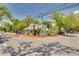 Charming street corner with lush landscaping around a building featuring unique architecture at 315 Ridge Rd, Palm Harbor, FL 34683