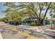 Ozona Brewing Company with vibrant outdoor seating and golf carts parked on the roadside at 315 Ridge Rd, Palm Harbor, FL 34683