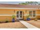 Inviting front entrance with double doors, potted plants, and a well-maintained walkway at 315 Ridge Rd, Palm Harbor, FL 34683