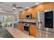 Modern kitchen featuring stainless steel appliances, wood cabinetry, and granite countertops at 315 Ridge Rd, Palm Harbor, FL 34683