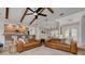 Open-concept living area with tile floors, a kitchen with a breakfast bar, and a dining area at 315 Ridge Rd, Palm Harbor, FL 34683