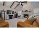 Inviting living room features a cozy stone fireplace, comfortable seating, and stylish decor at 315 Ridge Rd, Palm Harbor, FL 34683