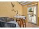 Cozy patio with a table for two; perfect for a quiet conversation at 315 Ridge Rd, Palm Harbor, FL 34683