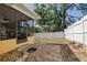 Enjoy outdoor living on this brick patio with a screened-in porch and a cozy seating area at 315 Ridge Rd, Palm Harbor, FL 34683