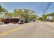 Street view of a retail business with golf carts parked out front under mature, shady trees at 315 Ridge Rd, Palm Harbor, FL 34683