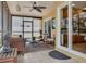 Cozy screened-in porch featuring comfortable seating and access to backyard at 315 Ridge Rd, Palm Harbor, FL 34683
