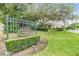 East Lake Landings deed restricted community entrance with lush landscaping and mature trees at 3205 Audubon Ct, Tarpon Springs, FL 34688
