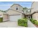 Charming two-story townhome with attached garage and well-manicured landscaping at 3205 Audubon Ct, Tarpon Springs, FL 34688