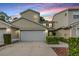 Charming two-story townhome with attached garage and well-maintained landscaping at 3205 Audubon Ct, Tarpon Springs, FL 34688