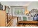 Bright main bedroom featuring wood floors, bay window, and ornamental wood trim at 3205 Audubon Ct, Tarpon Springs, FL 34688