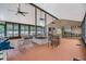 Spacious community pool clubhouse with ample seating, ceiling fans and natural light at 3205 Audubon Ct, Tarpon Springs, FL 34688