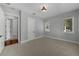 Bright bedroom features neutral tones, a walk-in closet, and two windows with natural light at 3212 W Fountain Blvd, Tampa, FL 33609
