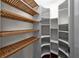 Walk-in closet with wood and white shelving at 3212 W Fountain Blvd, Tampa, FL 33609