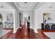 Elegant foyer with dark wood floors, white columns, and neutral walls leading to the main living areas at 3212 W Fountain Blvd, Tampa, FL 33609