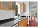 Butlers pantry with granite countertop and wood cabinets at 3212 W Fountain Blvd, Tampa, FL 33609