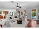 Spacious living room open to kitchen with view of the pool and natural light at 3212 W Fountain Blvd, Tampa, FL 33609