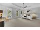 This main bedroom has a ceiling fan, three large windows and balcony access at 3212 W Fountain Blvd, Tampa, FL 33609