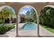 Outdoor pool area has a beautiful fountain and tropical landscaping for an oasis-like retreat at 3212 W Fountain Blvd, Tampa, FL 33609