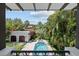 View of the pool, backyard, and guest house from a covered balcony at 3212 W Fountain Blvd, Tampa, FL 33609