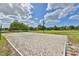Outdoor sand volleyball court with green space in the background at 344 Star Shell Dr, Apollo Beach, FL 33572