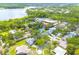 Overhead angle of a quaint neighborhood with trees and lake views at 3569 Oak Lake Dr, Palm Harbor, FL 34684