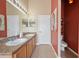 Clean bathroom with double sinks, ample counter space, and decorative accents at 35819 Diamond Head Ct, Zephyrhills, FL 33541