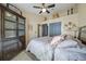 Bedroom featuring neutral walls and ceiling fan with a closet for storage at 35819 Diamond Head Ct, Zephyrhills, FL 33541