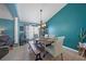 Inviting dining room with natural light, a wooden table, and a feature wall at 35819 Diamond Head Ct, Zephyrhills, FL 33541