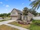 Attractive two-story home boasting a manicured lawn, tasteful landscaping, and a convenient two-car garage at 35819 Diamond Head Ct, Zephyrhills, FL 33541