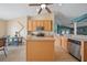 Well-equipped kitchen with an island, stainless steel appliances, and ample counter space at 35819 Diamond Head Ct, Zephyrhills, FL 33541