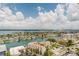 Breathtaking aerial view of waterfront homes, canals and the city skyline on a sunny day at 400 Island Way # 1709, Clearwater Beach, FL 33767
