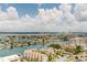 Expansive aerial view of stunning waterfront homes and calm canals under a blue sky with clouds at 400 Island Way # 1709, Clearwater Beach, FL 33767