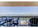 Inviting condo balcony seating area offering incredible waterfront views and a peaceful retreat at 400 Island Way # 1709, Clearwater Beach, FL 33767