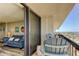 Balcony with chairs and ocean views and sliding doors leading to the living room at 400 Island Way # 1709, Clearwater Beach, FL 33767