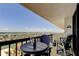 Charming balcony with table and chairs; enjoy stunning waterfront views from this inviting outdoor space at 400 Island Way # 1709, Clearwater Beach, FL 33767