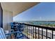 Relaxing condo balcony with Adirondack chairs and table overlooking panoramic waterfront views and cityscape at 400 Island Way # 1709, Clearwater Beach, FL 33767