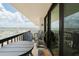 Condo balcony with comfortable seating and stunning views of the city and water at 400 Island Way # 1709, Clearwater Beach, FL 33767