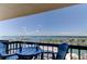 Balcony with chairs and a table offers panoramic views of the ocean at 400 Island Way # 1709, Clearwater Beach, FL 33767