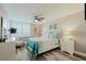 Coastal-themed bedroom with a queen-size bed, tropical decor, and natural light from the window at 400 Island Way # 1709, Clearwater Beach, FL 33767