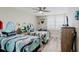 Charming bedroom featuring two twin beds with decorative surfboard headboards and coastal decor at 400 Island Way # 1709, Clearwater Beach, FL 33767