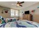 Comfortable bedroom with coastal themed decorations, twin beds, and a flat screen television on a dresser at 400 Island Way # 1709, Clearwater Beach, FL 33767