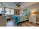 Charming bedroom with a ceiling fan, flamingo accents, and a large window offering a serene view at 400 Island Way # 1709, Clearwater Beach, FL 33767