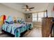 Cozy bedroom featuring twin beds with surfboard headboards, nautical decor, and a bright window at 400 Island Way # 1709, Clearwater Beach, FL 33767