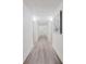 Neutral hallway with wood-look flooring, white walls, and recessed ceiling lights at 400 Island Way # 1709, Clearwater Beach, FL 33767