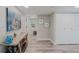 Bright hallway with wood floors, decorative accents, and a glimpse into other rooms at 400 Island Way # 1709, Clearwater Beach, FL 33767