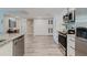 Bright kitchen with stainless appliances, granite countertops, and ample cabinet space at 400 Island Way # 1709, Clearwater Beach, FL 33767