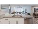 View of the modern, renovated kitchen that opens to the living room at 400 Island Way # 1709, Clearwater Beach, FL 33767