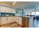 Kitchen area boasts stainless steel appliances, granite countertops, under-cabinet lighting and a breakfast bar at 400 Island Way # 1709, Clearwater Beach, FL 33767