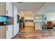 Well-lit kitchen with stainless appliances, tile backsplash, granite countertops, and island with breakfast bar at 400 Island Way # 1709, Clearwater Beach, FL 33767